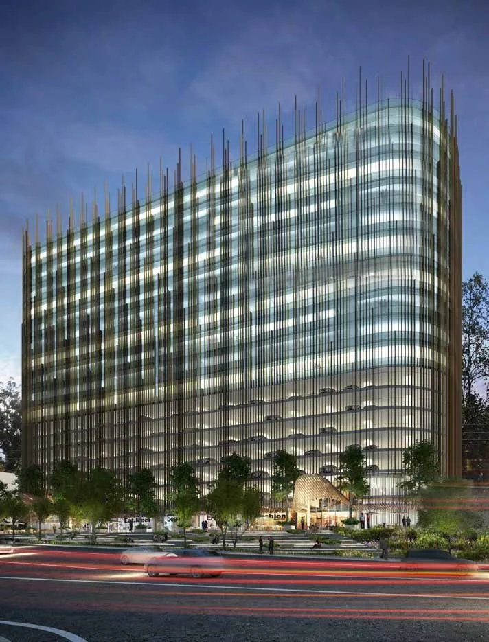 Nočný rohový pohľad na kancelársky a retailový development Skyview