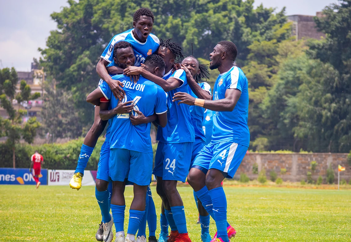 Nairobi City Stars football players celebrating together on the pitch